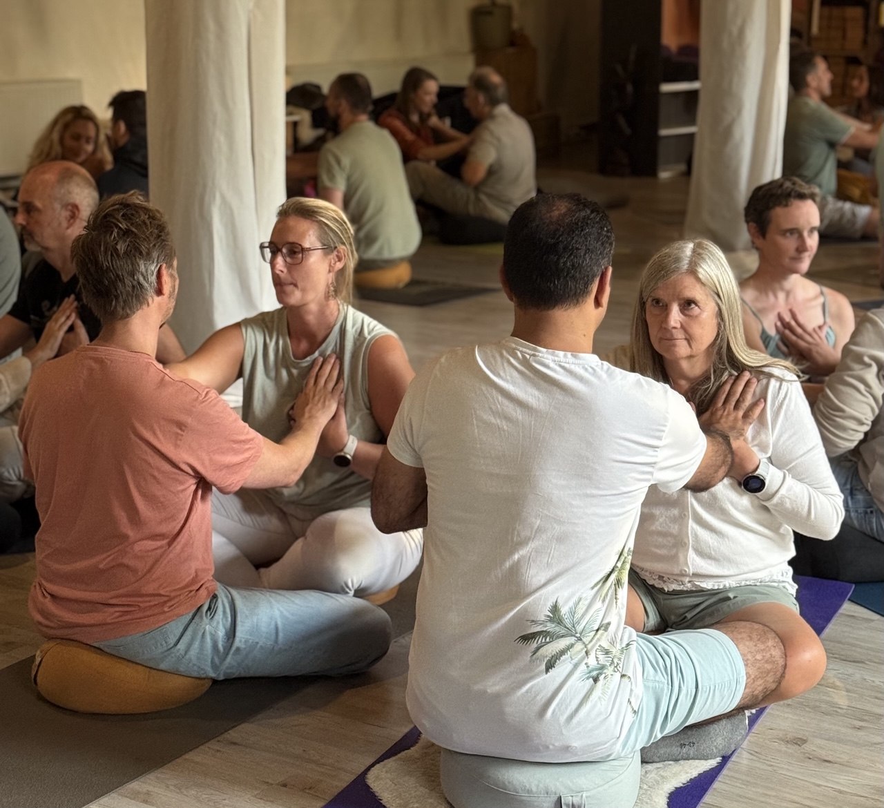 Participants pairing up in a SoulKonnect group workshop