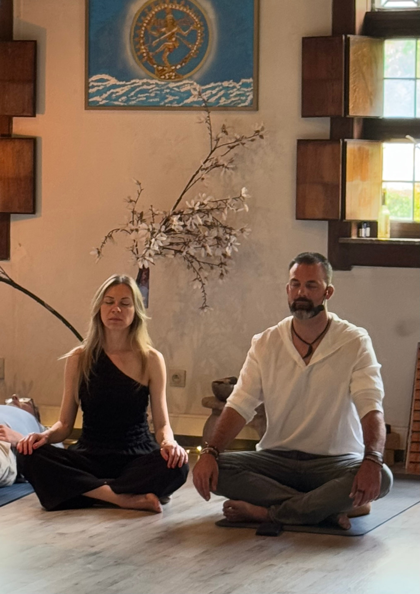 Mattias and Tatyana seated in meditation
